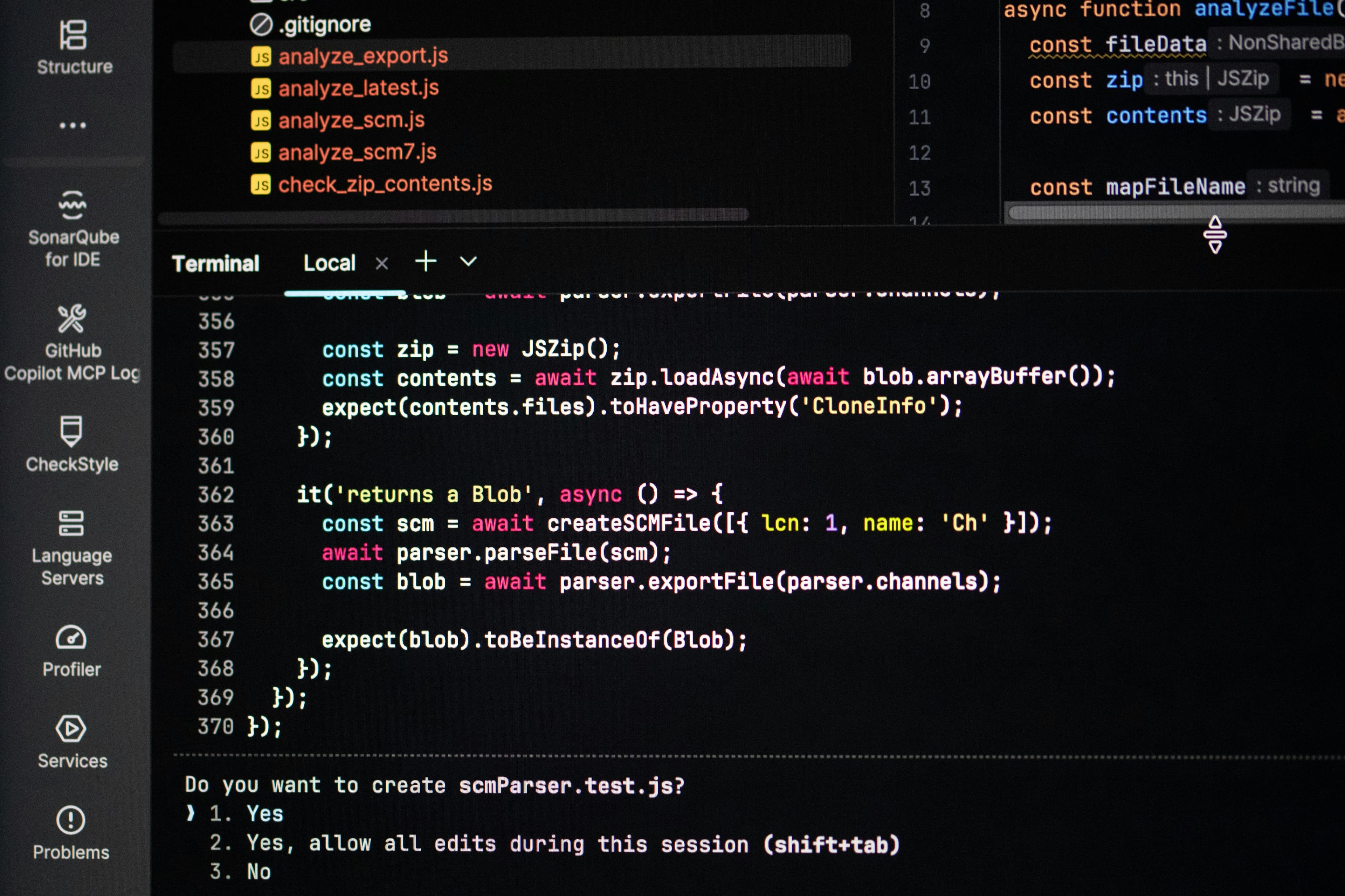 Code on a dark screen representing web development work